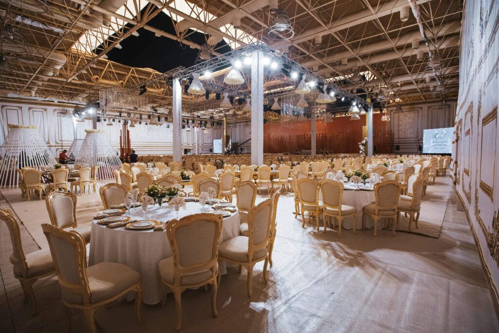 Luxurious banquet hall with elegantly set tables and chairs for a grand event.